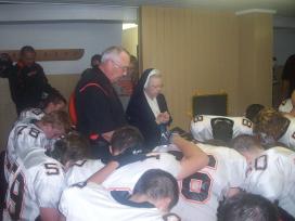 2009-09-17 Sr. Audrey praying with Springdale Football Team vs. North Catholic