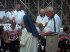 2011-09-02 Sr. Audrey praying with Springdale Football team vs. North Catholic